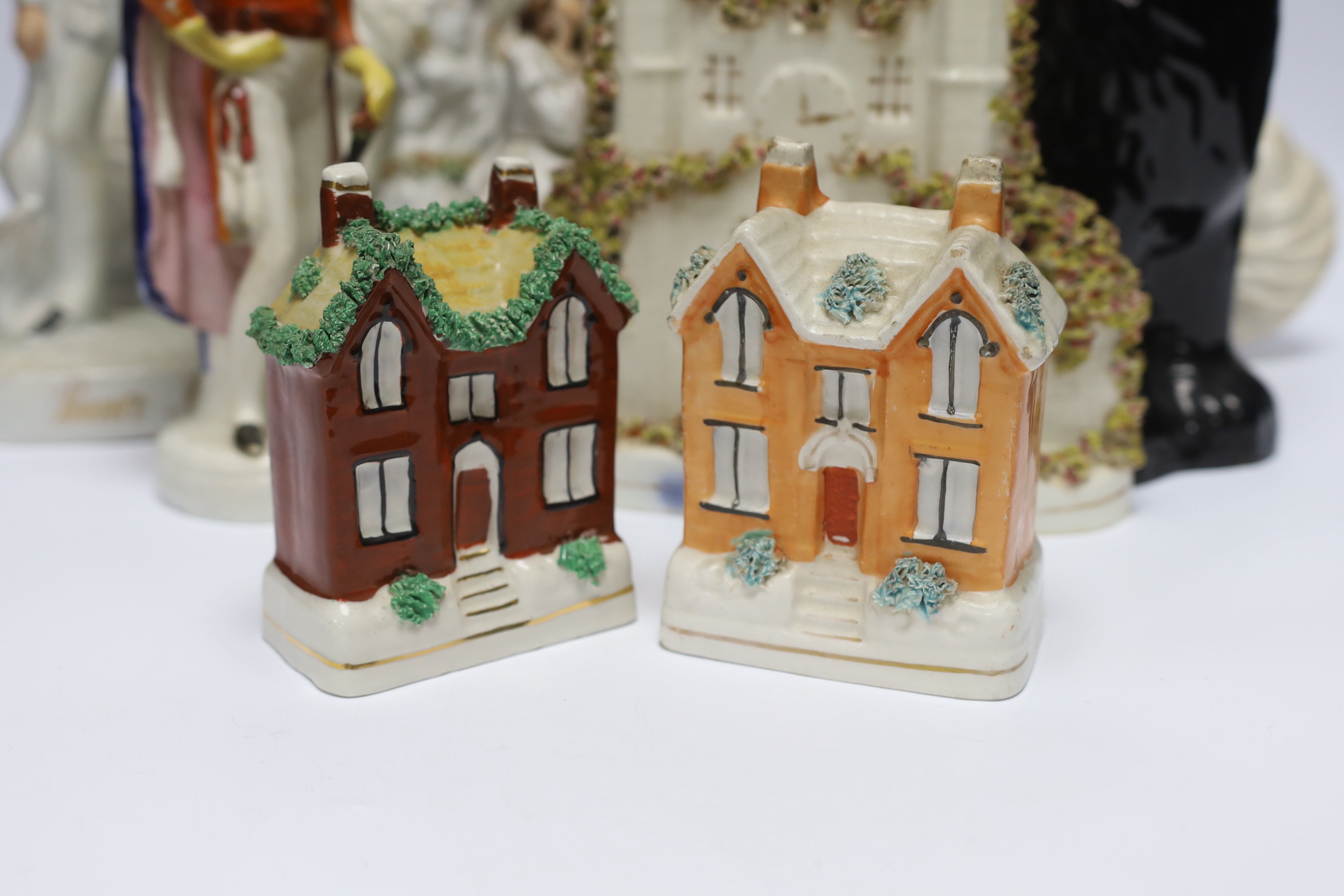 A mixed collection of Staffordshire figure groups to include various spaniels, Prince Albert figure, further courting couples and other bocage groups